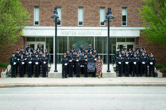 Local Police Officers Pose for a Graduation picture 
