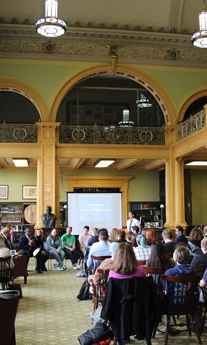 People meeting in a large room.