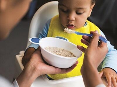 mom feeding her child